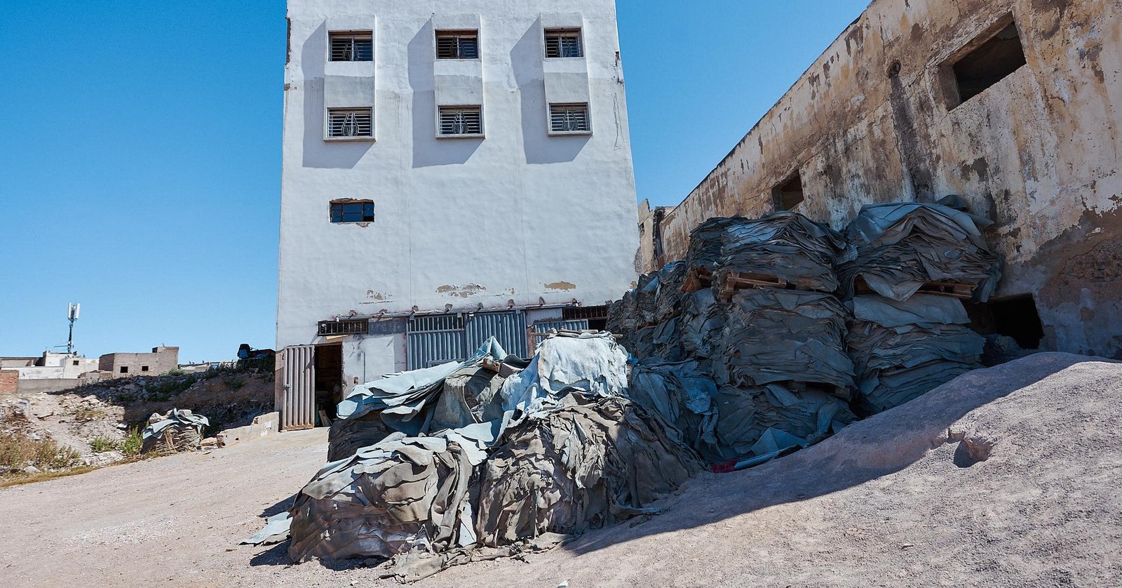 Why the Legendary Chouara Tannery in Fez Is Still a Must-See After 1,000 Years 2 Chouara Tannery Artisan scraping goat hide by hand at tannery